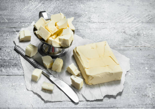 istock Butter in a bowl with a knife. 1141487752