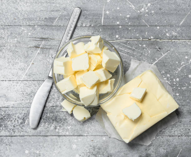 istock Butter in a glass bowl with a knife. 1141488423