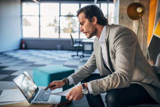istock Businessman working on laptop in the modern office 1141489002