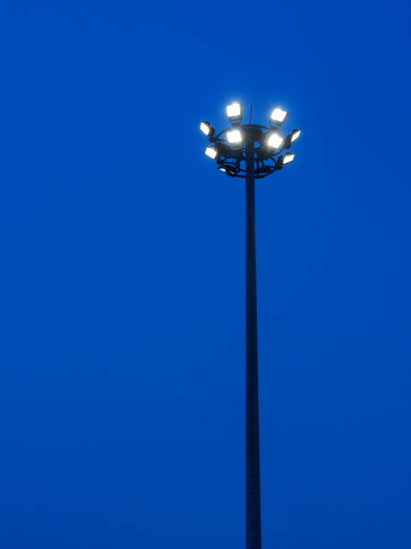 istock Street lighting or spotlight lamp against blue sky background 1141489288