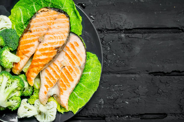istock Grilled salmon steaks with fresh broccoli in a plate. 1141490505