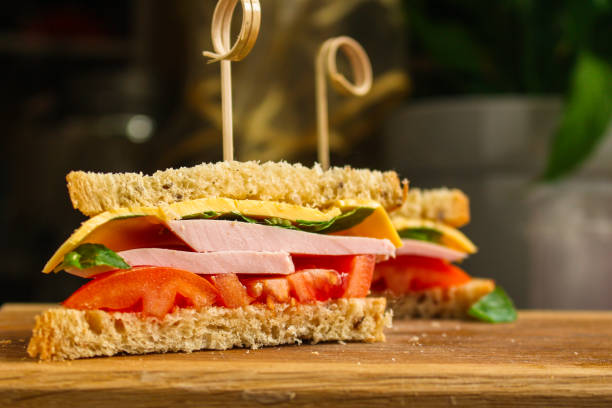 club sandwich with  ham, cheese, tomato, lettuce and sauce. top food background. copy space - sandwich club sandwich ham turkey imagens e fotografias de stock