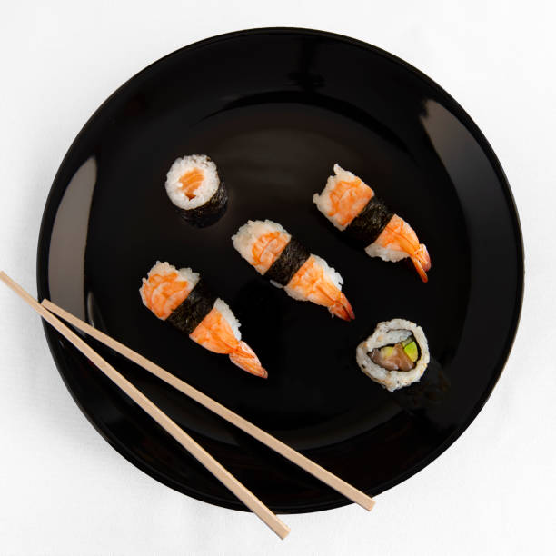 istock mixed sushi on black plate seen from above 1141491946