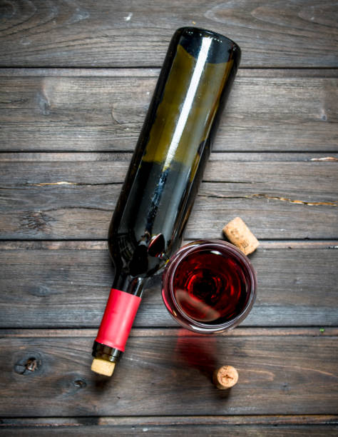 istock Wine background. Red wine in a bottle with a glass. 1141492936