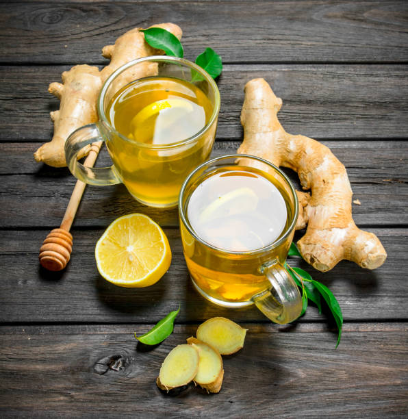 istock Ginger tea and lemons with leaves. 1141493397
