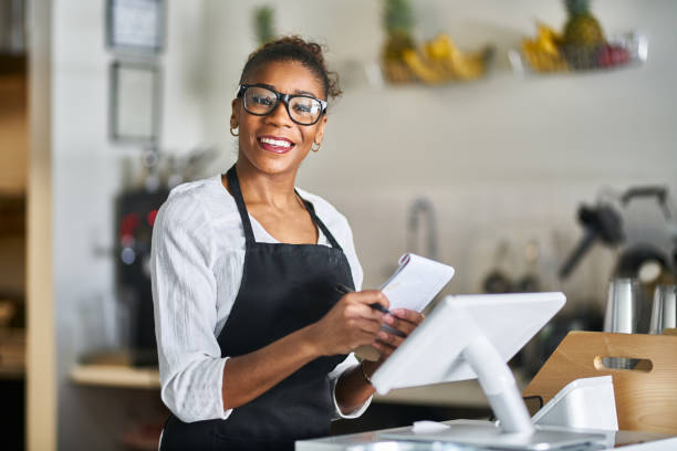 istock smiling waitress ready to take down order at restaurant counter 1141493814