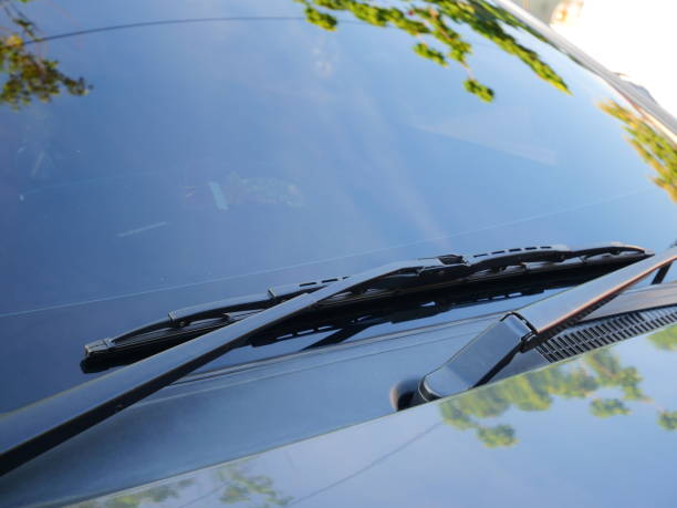 Wipers of a Black Car Windshield, Glass - Material, Window, Reflection, Light - Natural Phenomenon windshield wiper photos stock pictures, royalty-free photos & images