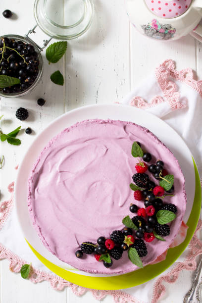 istock Cake with Black Currant Cream, Souffle and Biscuit on the white kitchen table. Top view flat lay background, copy space. 1141500893