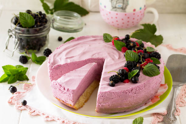 istock Cake with Black Currant Cream, Souffle and Biscuit on the white kitchen table. 1141500899