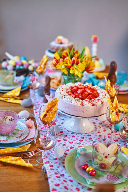 istock Decorated Table for Easter with Easter Eggs, Cookies, Cake and Flowers 1141501910
