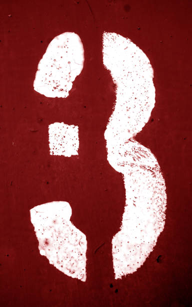 istock Number 3 in stencil on metal wall in red tone. 1141504566