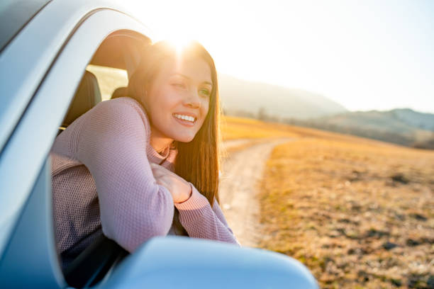 istock Young driver portrait looking at the car window 1141505569