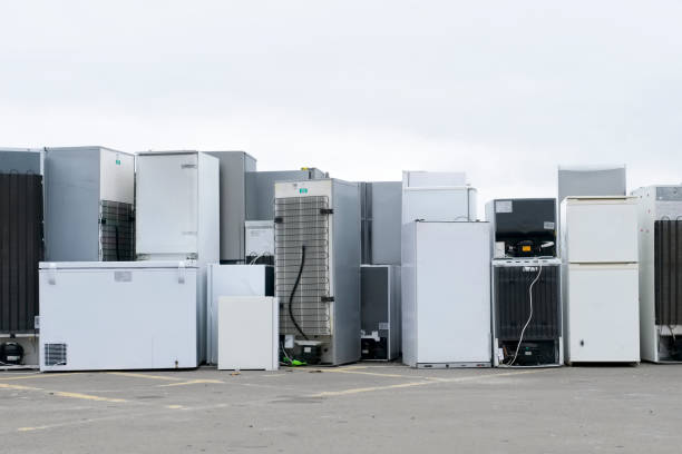 istock Old fridges freezers refrigerant gas at refuse dump skip recycle stacked pile plant help environment reduce pollution white silver 1141507270