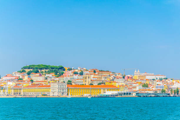 istock praca do comercio square with the saint george castle in Lisbon viewed from Tajo river, Portugal. 1141507363