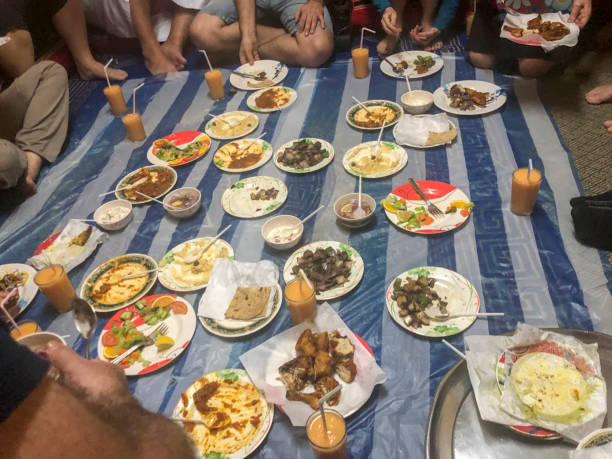 View of plate with food, fork and spoon, Oman