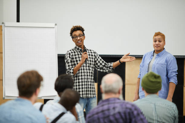 istock Young speaker talking to audience at conference 1141509198