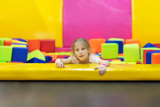 istock girl climbs out of soft cubes 1141511348
