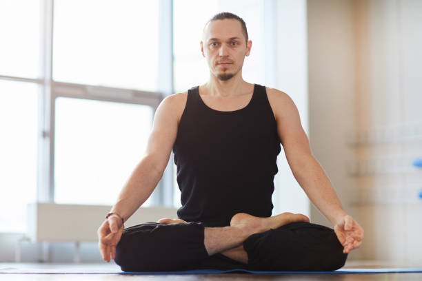 istock Muscled young man meditating alone 1141511873