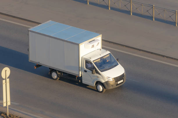 istock Several delivery van and white logistic truck driving on the highway. 1141512224