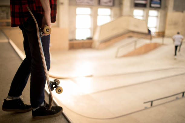Standing on Ramp Unrecognizable skater standing on ramp ready to do stunts in extreme park, copy space skater feet stock pictures, royalty-free photos & images