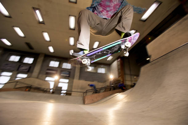 istock Skater Flipping Skateboard 1141512446