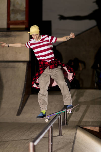 istock Skateboarder Sliding on Rail 1141512447