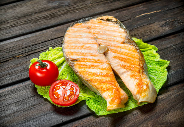 istock Grilled salmon steak on a lettuce leaf . 1141513579