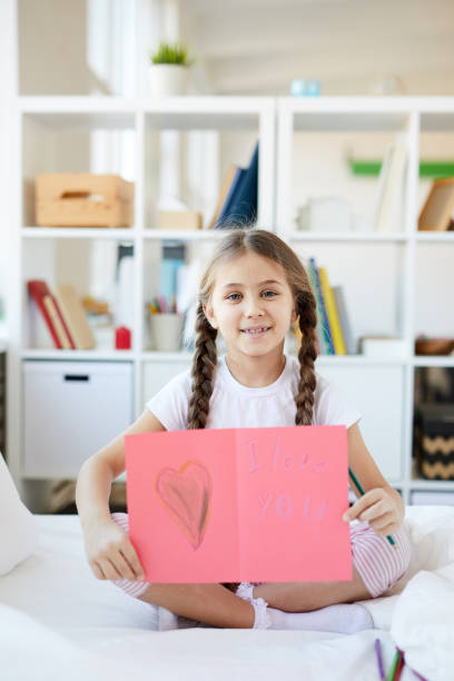 istock Girl Showing Handmade Card 1141513746