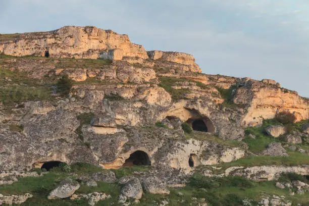 The hill in front of Matera with caves carved into the rock. Matera, Italy