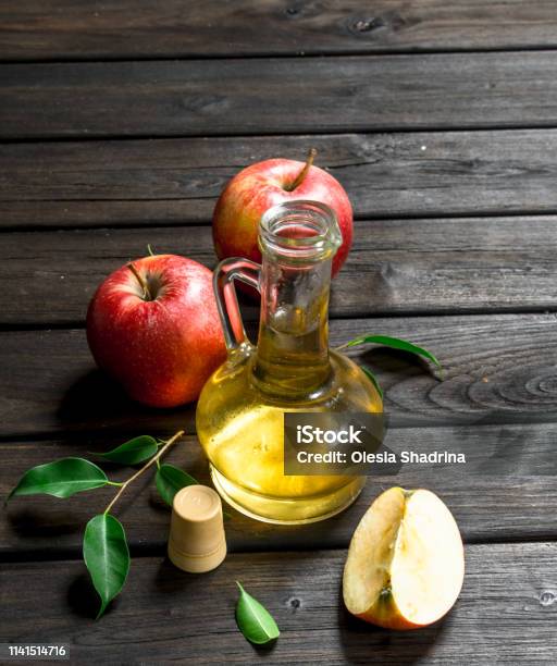 Apple Cider Vinegar With Fresh Apples Stock Photo - Download Image Now - Apple Cider Vinegar, Bottle, Vertical