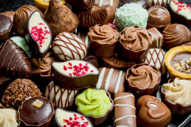 istock Chocolate candies with nuts and various fillings. 1141514792