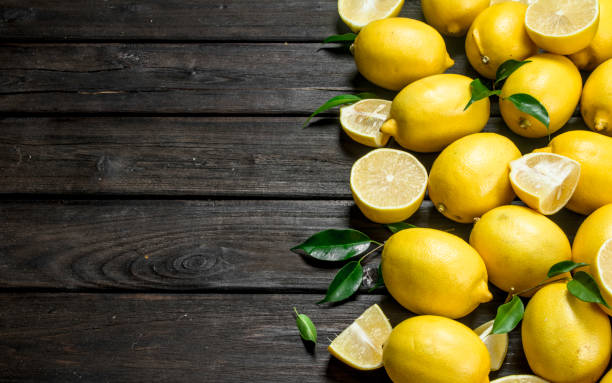 istock Juicy sour lemons with leaves. 1141515354