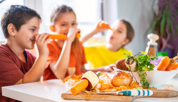 istock Happy children having fun with vegetable 1141515365