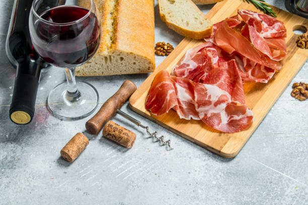 istock Traditional Spanish ham with ciabatta and red wine. 1141516005