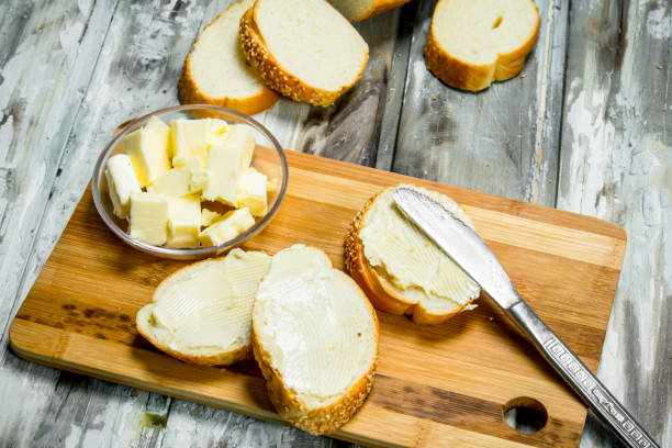 istock Fresh bread and butter on the Board . 1141516689
