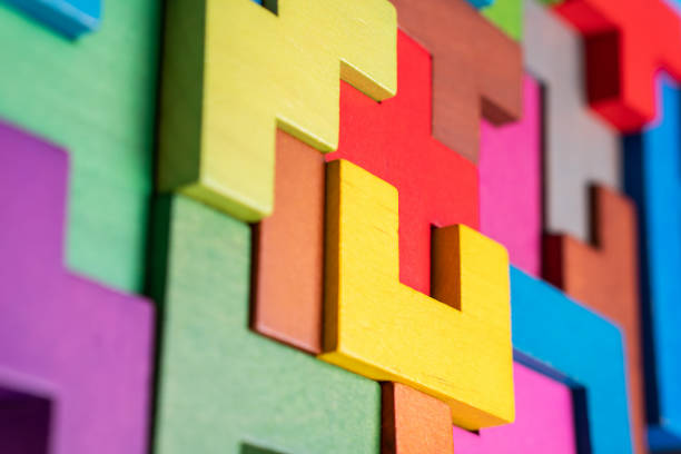 The concept of logical thinking. Geometric shapes on a wooden background.