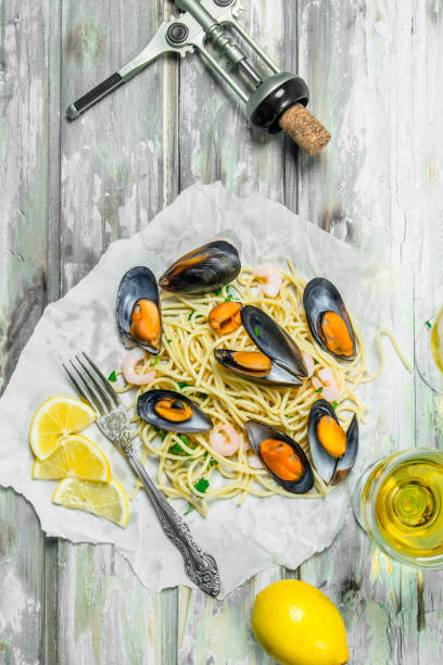 istock Mediterranean pasta. Spaghetti seafood, clams and white wine. 1141518263