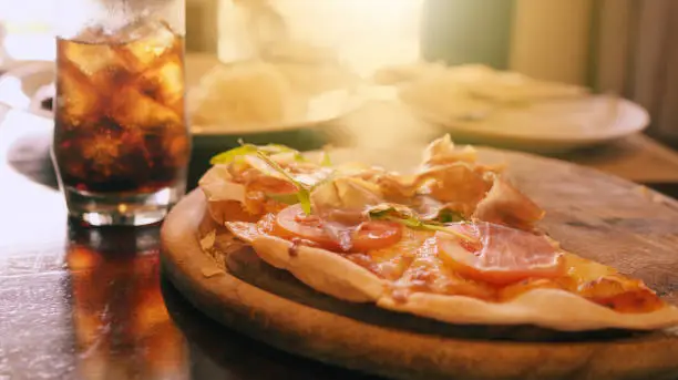 Photo of Pizza parma ham from the wooden pan the Italian food.