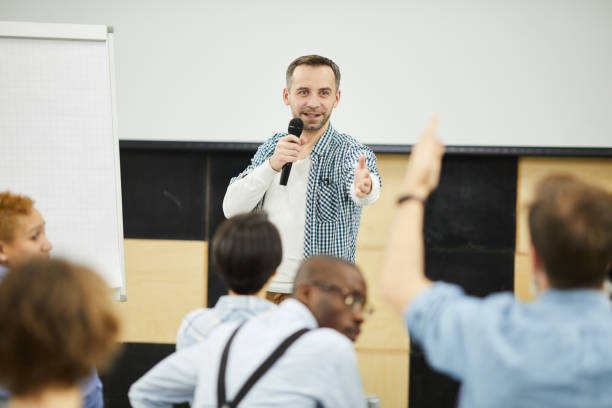 istock Business coach answering question from audience 1141521104