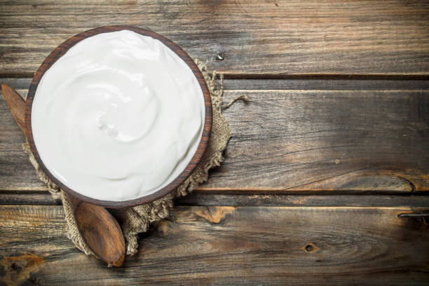 istock Fresh sour cream in bowl with spoon . 1141521310