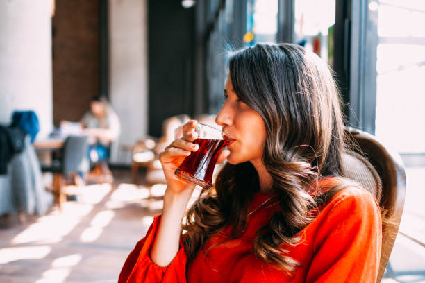 istock Brunette Woman Drinking Tea 1141521579