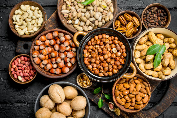 istock Assortment of different nuts in bowls. 1141522008