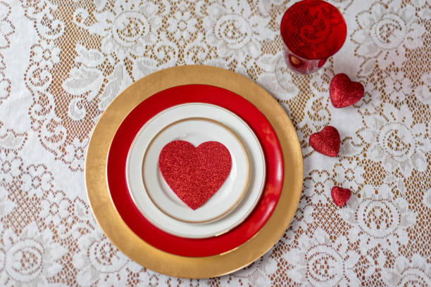 istock Valentines Day place setting - red hearts on white lace 1141522262