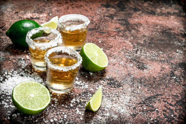 istock Tequila in a shot glass with salt and sliced lime. 1141522589