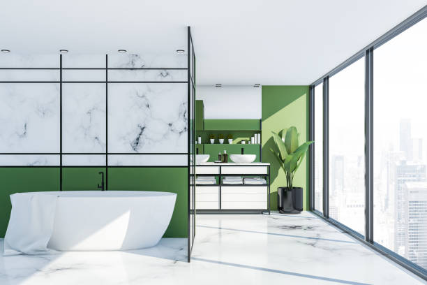 istock Green and marble bathroom, tub and sinks 1141522606