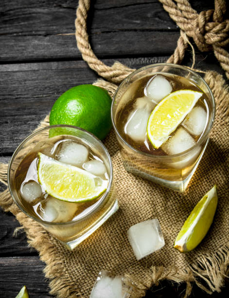 istock Whiskey in a glass with lime and ice on the sack. 1141523114