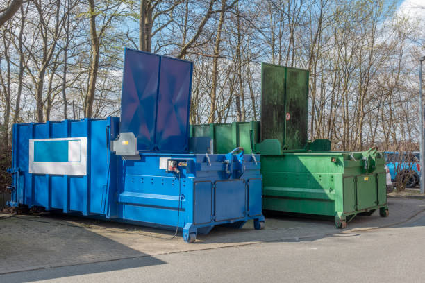 two large garbage compactors standing on a hospital site two large garbage compactors standing on a hospital site compactor photos stock pictures, royalty-free photos & images