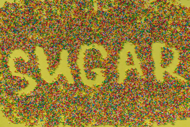 istock SUGAR word written in sprinkles. 1141524358