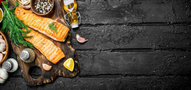 istock Grilled salmon fillet with spices and dill branches. 1141524644