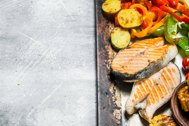 istock Grilled salmon steaks with vegetables. 1141524740